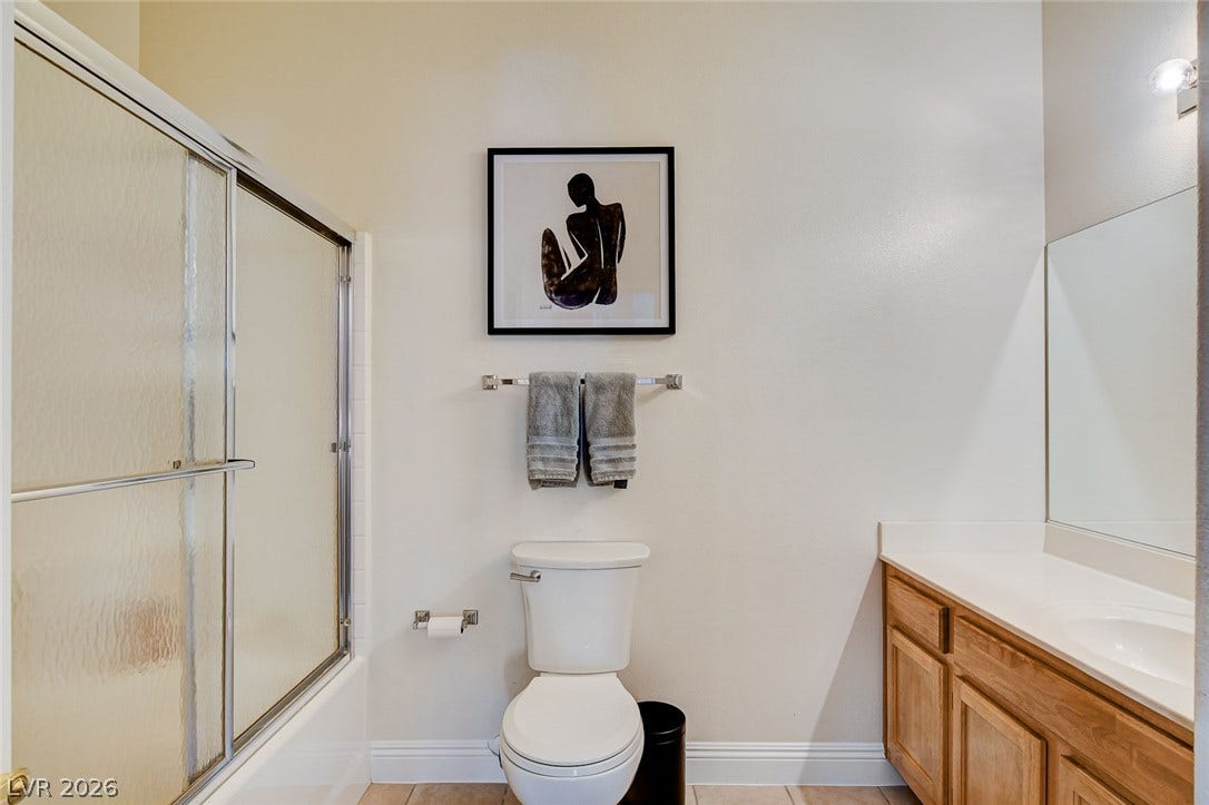 1520 Ruby Cliffs Lane, #203, Las Vegas, NV 89144 Clean lines and classic cabinetry define this functional bathroom space.