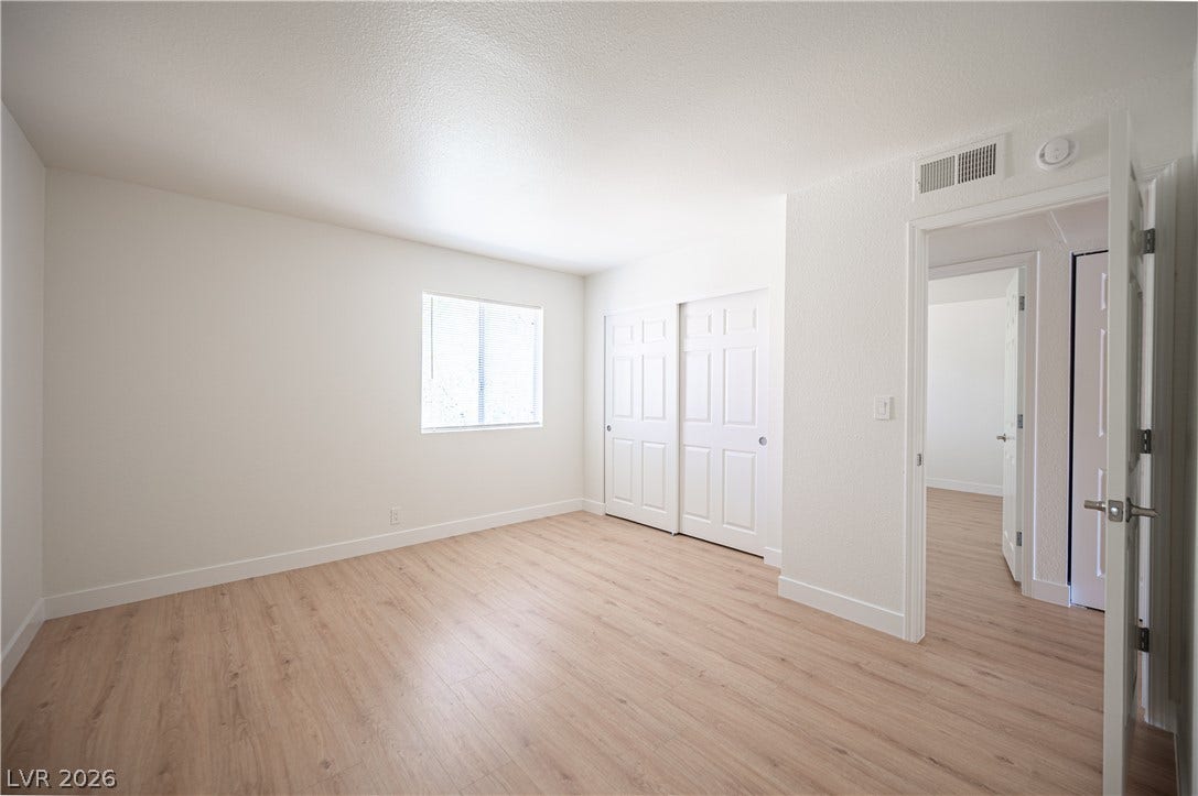 4381 Alexis Drive, #332, Las Vegas, NV 89103 Smooth wood-plank flooring runs throughout this versatile secondary bedroom space.