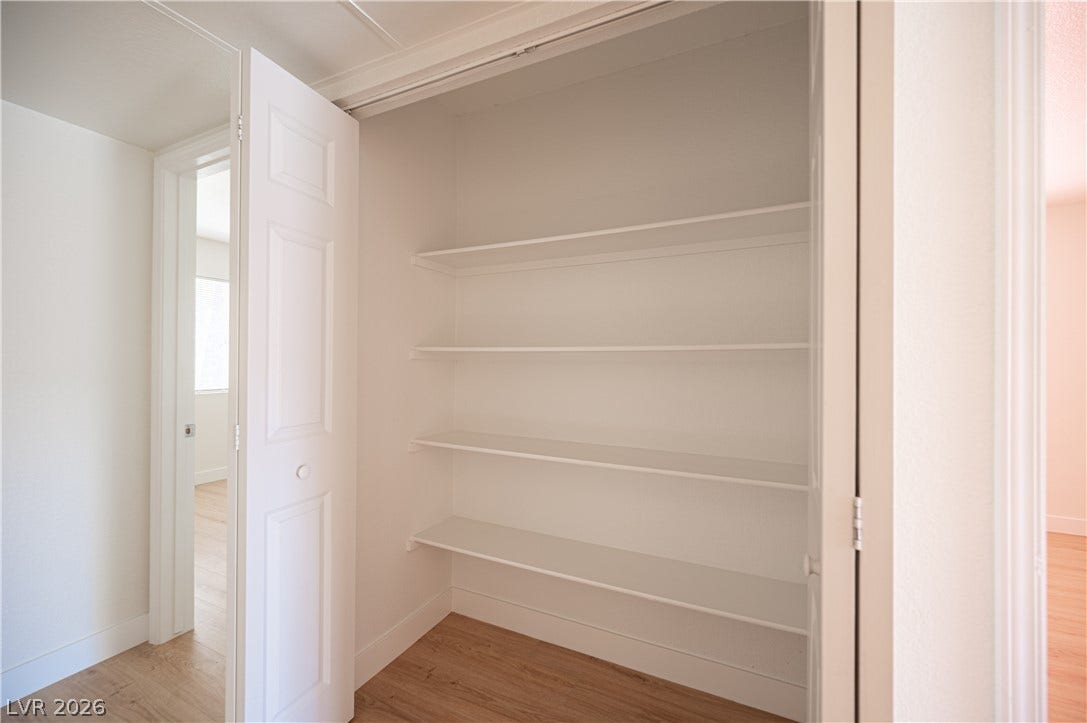 4381 Alexis Drive, #332, Las Vegas, NV 89103 Ample built-in shelving maximizes storage potential within this clean, functional closet space.
