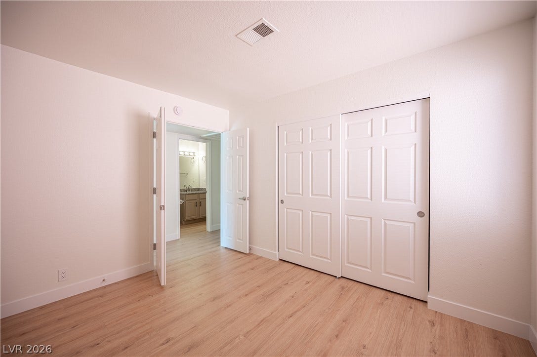 4381 Alexis Drive, #332, Las Vegas, NV 89103 Smooth wood floors and crisp white trim enhance this versatile auxiliary bedroom.