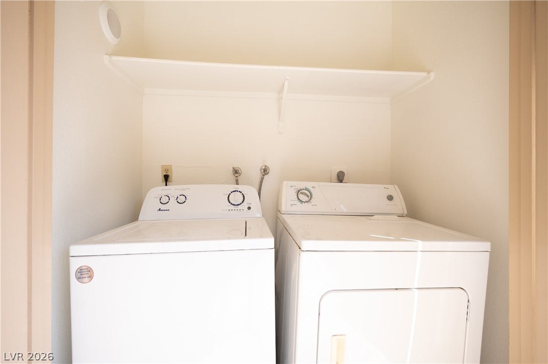 4381 Alexis Drive, #332, Las Vegas, NV 89103 An organized laundry closet features built-in shelving above the washer and dryer units.