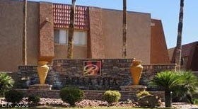 4381 Alexis Drive, #332, Las Vegas, NV 89103 A stone monument sign framed by desert landscaping welcomes residents to the community.