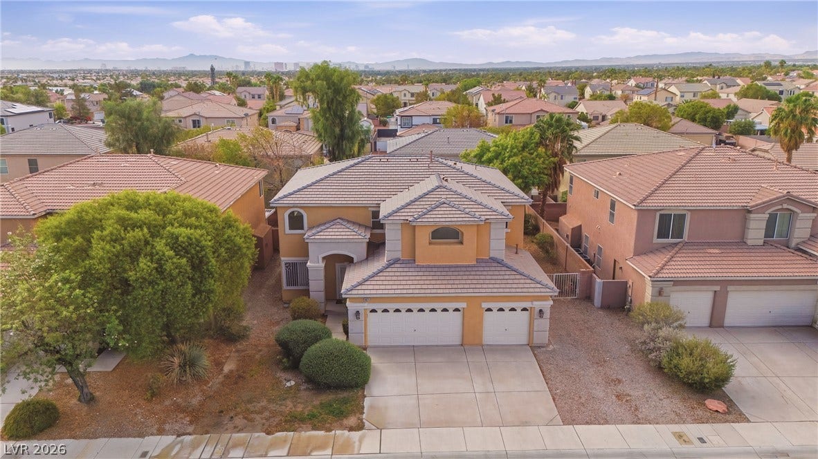 4871 Lionesse Court, Las Vegas, NV 89130 A classic tile roof and multi-car garage define this elegant two-story suburban residence.