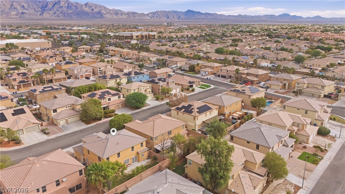 4871 Lionesse Court, Las Vegas, NV 89130 A quiet residential neighborhood rests below a majestic mountain backdrop.