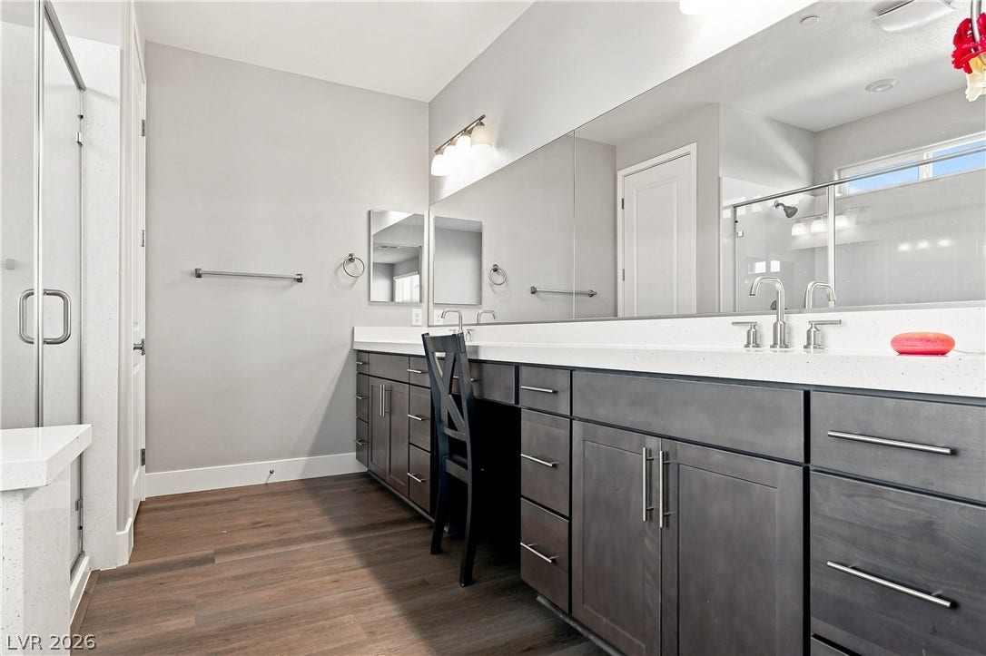 Clean lines and a spacious dual vanity highlight this contemporary bathroom space.