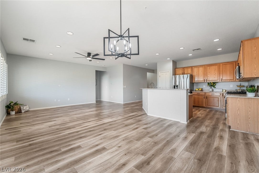Upgraded drop-in outlet to conceal TV wires along with an upgraded dining room chandelier