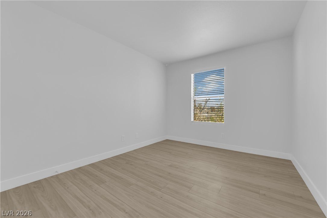5111 Lindell Road, #202, Las Vegas, NV 89118 Smooth wood-look flooring and a single window define this versatile interior space.