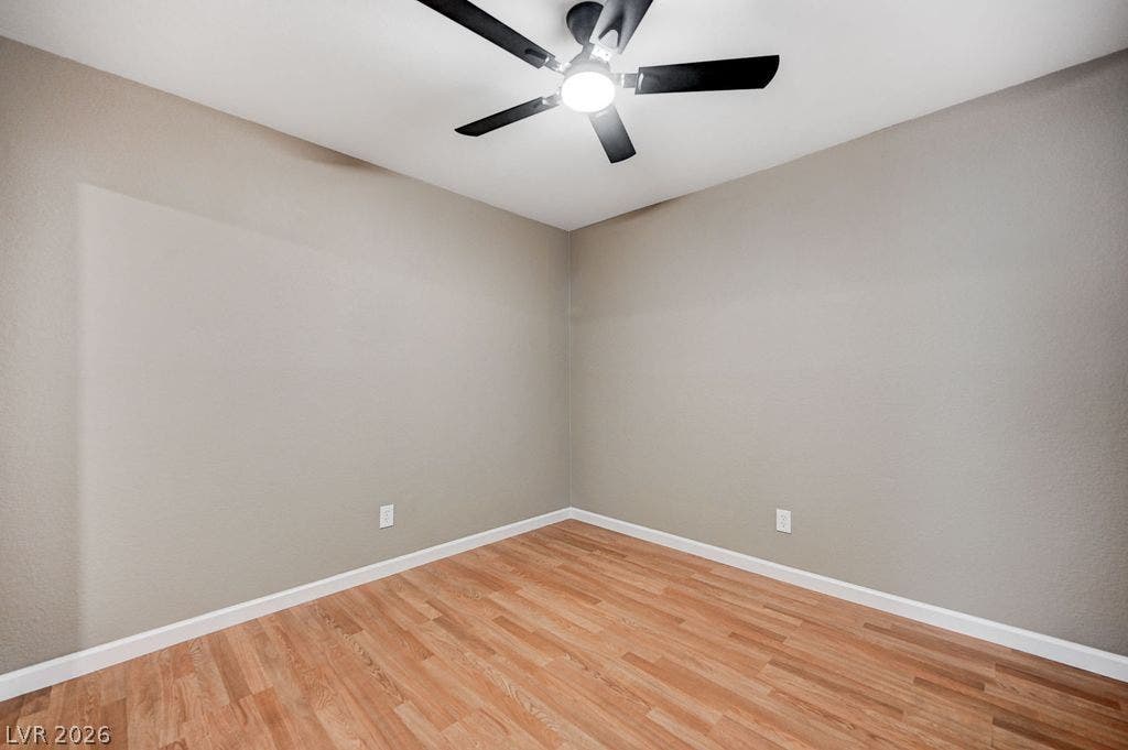 2191 Pinetop Lane, #104, Las Vegas, NV 89119 Smooth wood-style flooring runs throughout this versatile, neutral-toned room.
