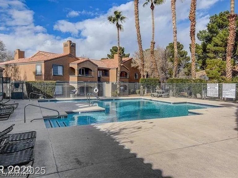 5220 Mission Carmel Lane, #104, Las Vegas, NV 89107 Community pool with a patio