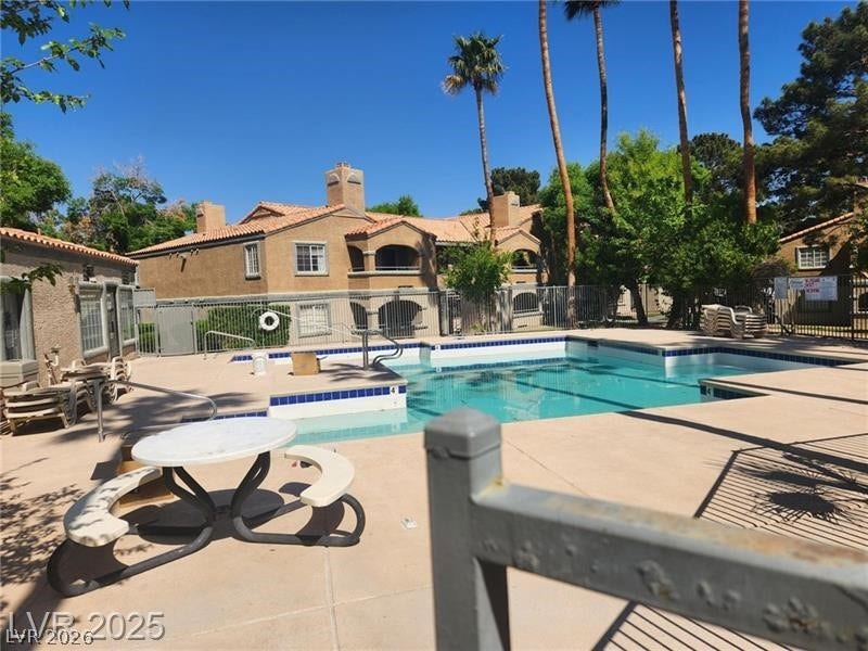 5220 Mission Carmel Lane, #104, Las Vegas, NV 89107 Community pool with a patio