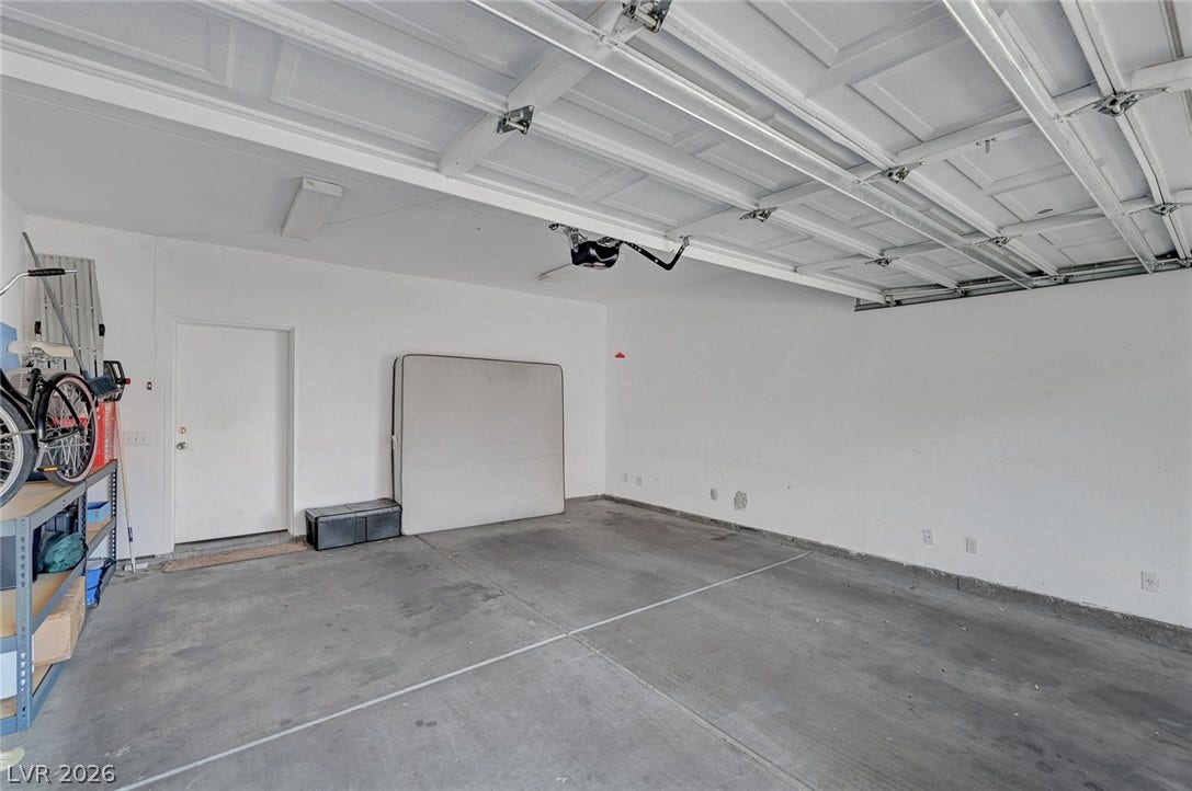 7450 S Eastern Avenue, #1064, Las Vegas, NV 89123 An attached garage features concrete flooring and direct interior home access.