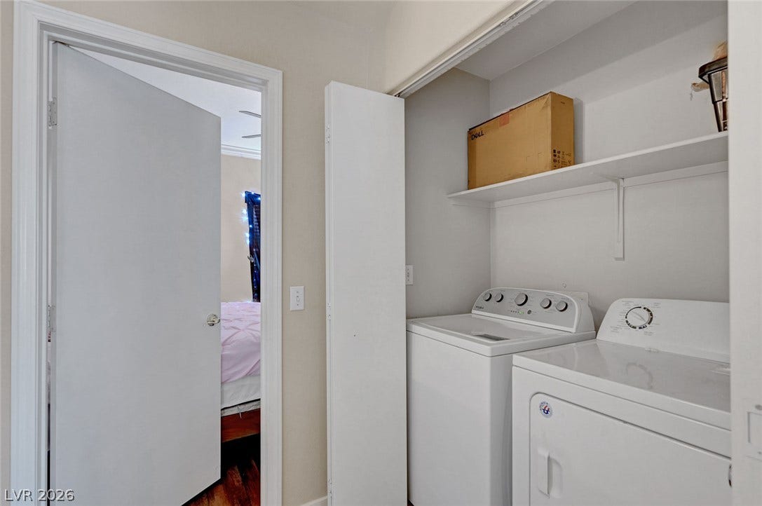 7450 S Eastern Avenue, #1064, Las Vegas, NV 89123 An organized laundry closet contains essential appliances and storage shelving.