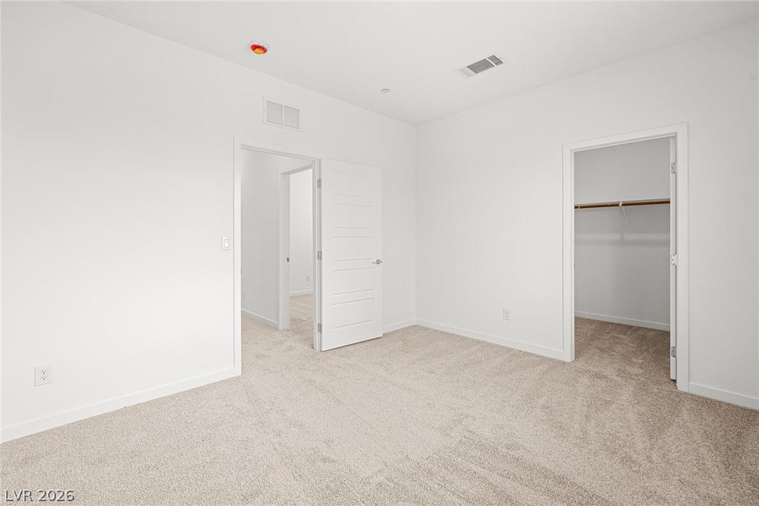 9568 Sagebrush Grove Street, Las Vegas, NV 89178 Soft carpeting underfoot defines this comfortable room complete with an adjacent walk-in closet.