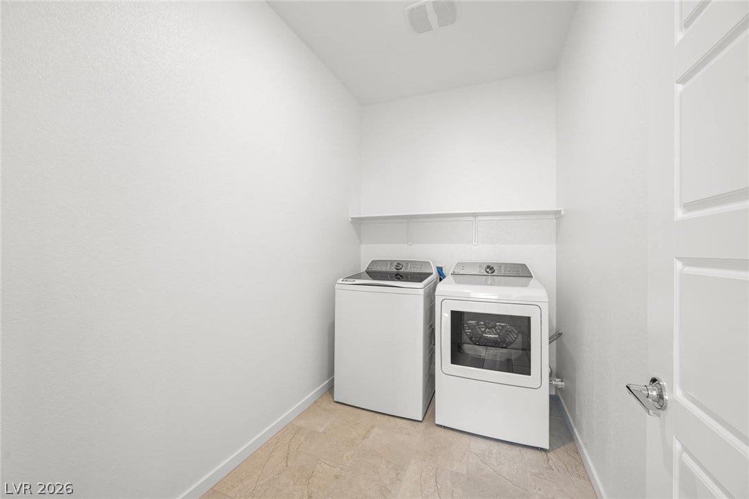 9568 Sagebrush Grove Street, Las Vegas, NV 89178 Functional tile flooring complements the practical design of this dedicated laundry space.