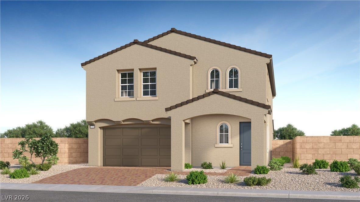 11829 Mimicking Song Lane, Las Vegas, NV 89138 A classic tiled roof and arched windows define the exterior of this two-story home.