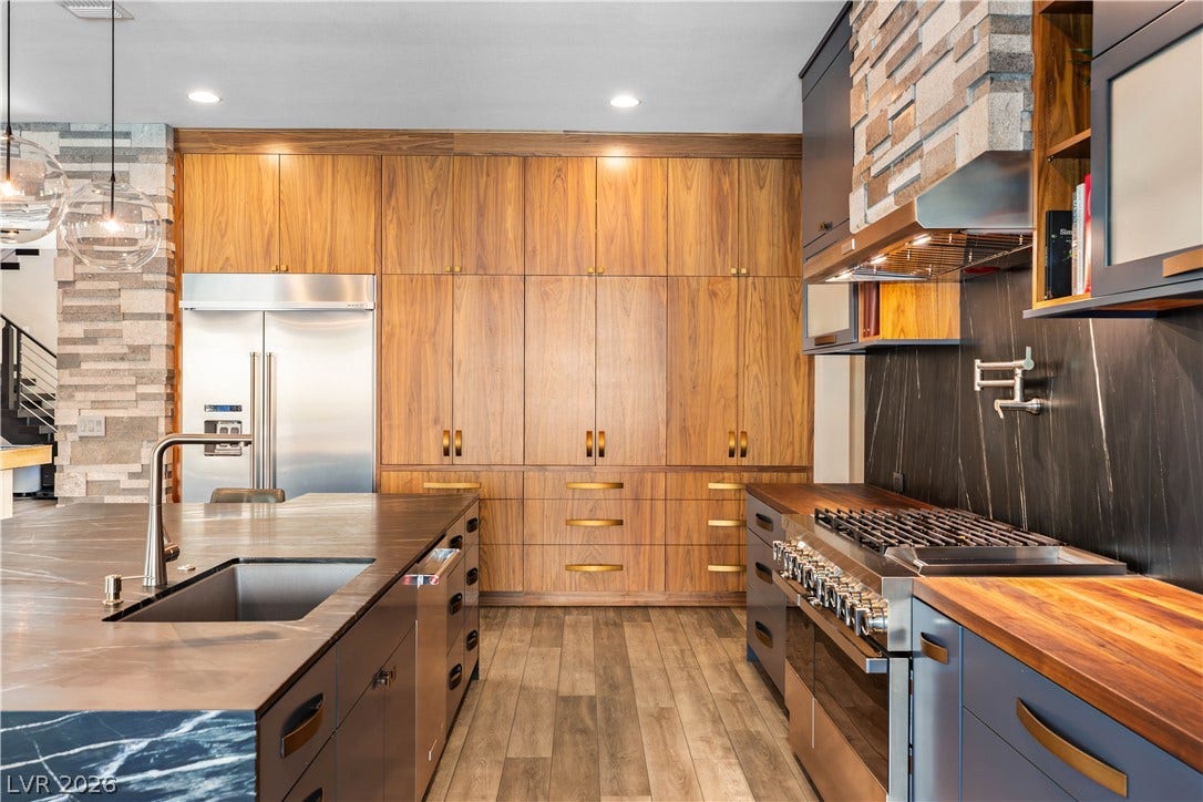 2999 The Peaks Lane, Las Vegas, NV 89138 2023 kitchen remodel features soapstone & butcher block counters, custom walnut cabinetry & a prep kitchen in the butlers pantry.
