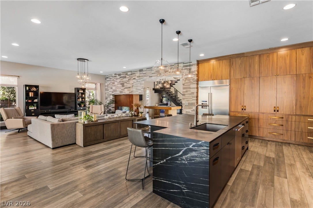 2999 The Peaks Lane, Las Vegas, NV 89138 An open layout connects the custom kitchen with the living area.