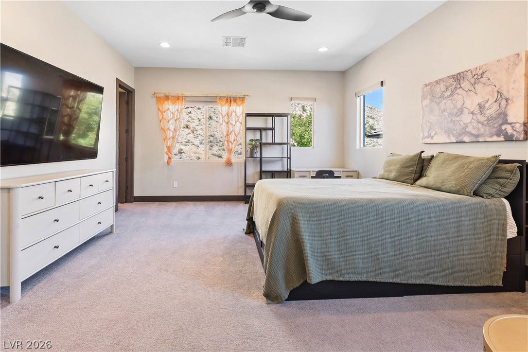 2999 The Peaks Lane, Las Vegas, NV 89138 Upstairs bedroom (4) with sitting area, custom walk-in closet and en-suite bathroom.