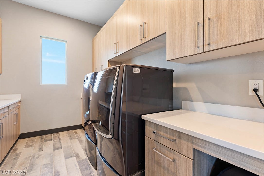 2999 The Peaks Lane, Las Vegas, NV 89138 beautifully upgraded laundry room with lots of cabinets and countertop space.