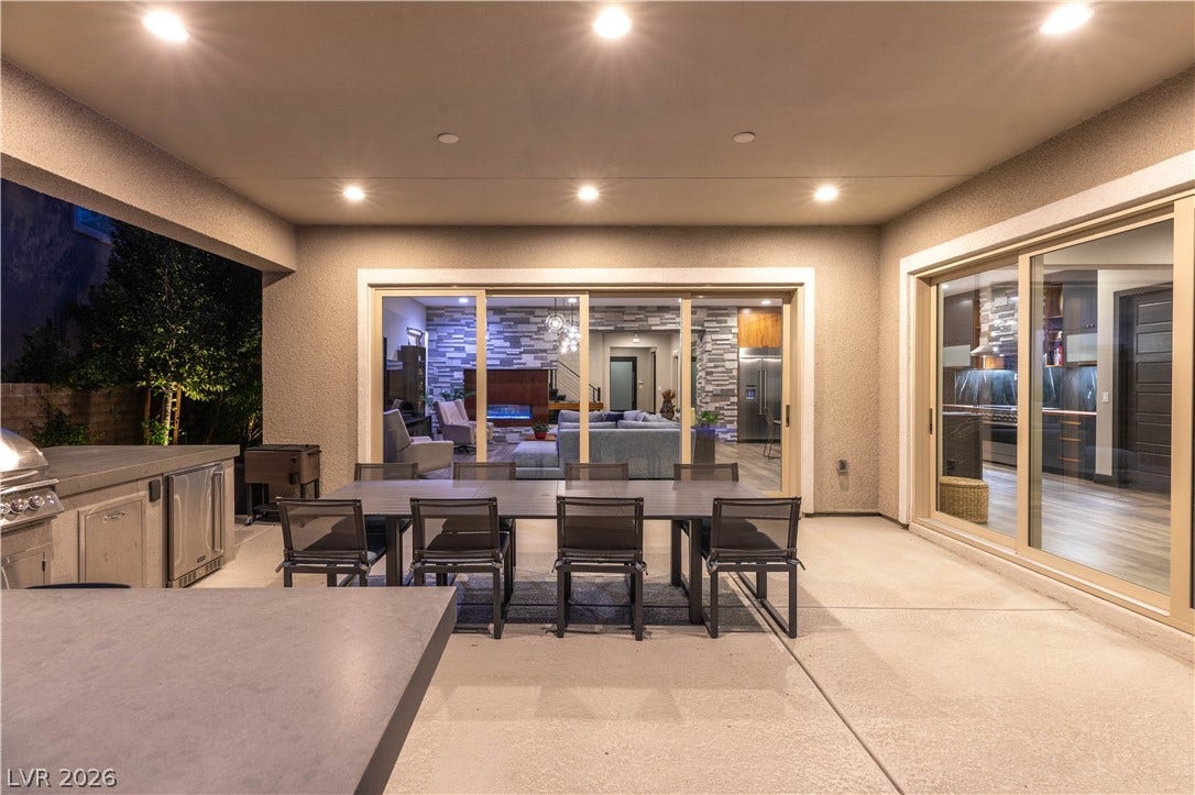 2999 The Peaks Lane, Las Vegas, NV 89138 Patio with built in BBQ and refrigerator off dining and living space.