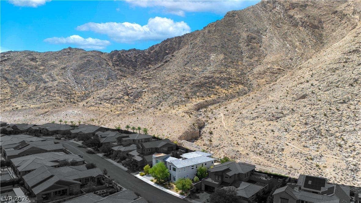 2999 The Peaks Lane, Las Vegas, NV 89138 Dramatic mountain vistas rise directly behind this desert neighborhood setting.