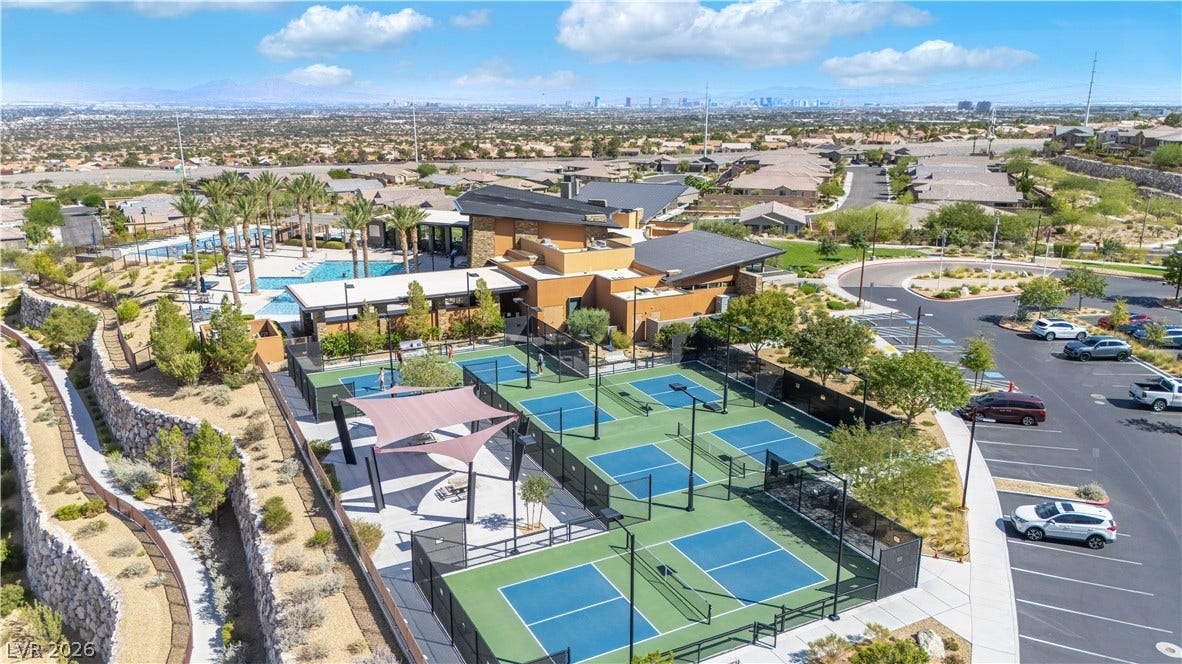 2999 The Peaks Lane, Las Vegas, NV 89138 16,000 sq ft Clubhouse with a 3,000 sq ft pool, 1,600 sq ft lap pool, 800 sq ft spa, fitness center, multipurpose rooms, 4 lighted pickleball courts, volleyball court, great room, event lawn space, outdoor fire terrace with Strip view, ping pong / billiards terrace and picnic area.