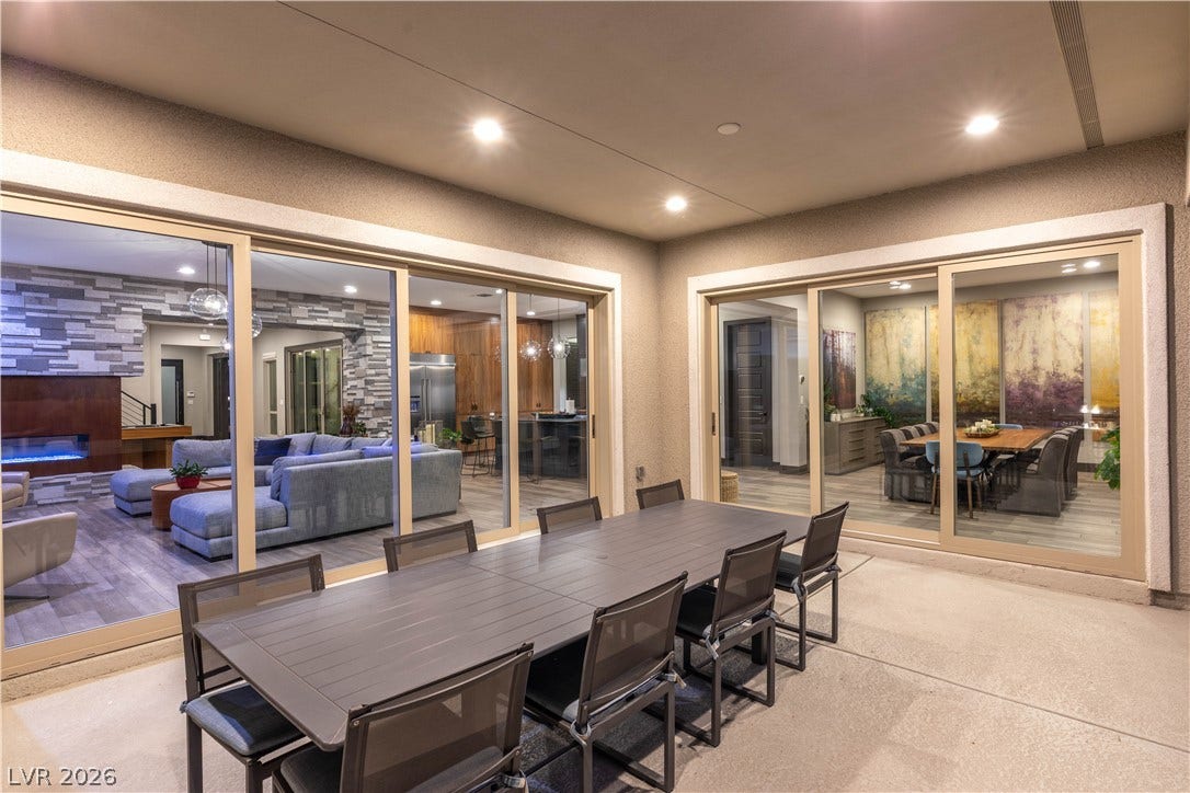 2999 The Peaks Lane, Las Vegas, NV 89138 Expansive sliding glass doors connect this sheltered concrete patio directly to the main living areas.