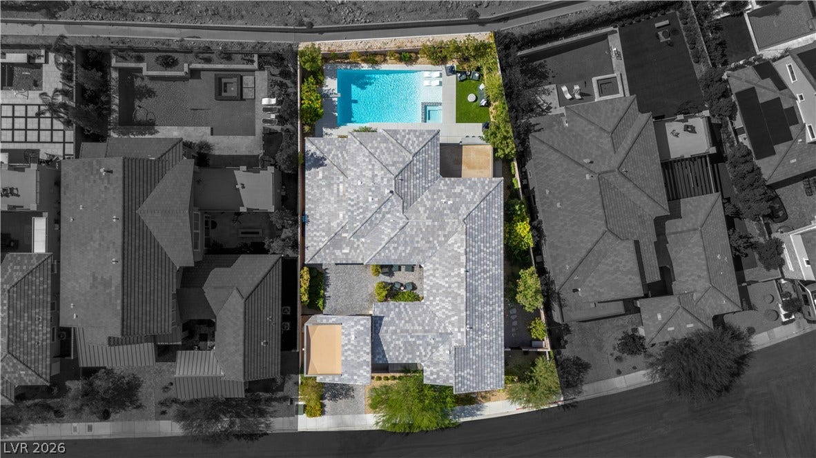2999 The Peaks Lane, Las Vegas, NV 89138 An aerial perspective showcases the structured tile roof and pristine swimming pool.