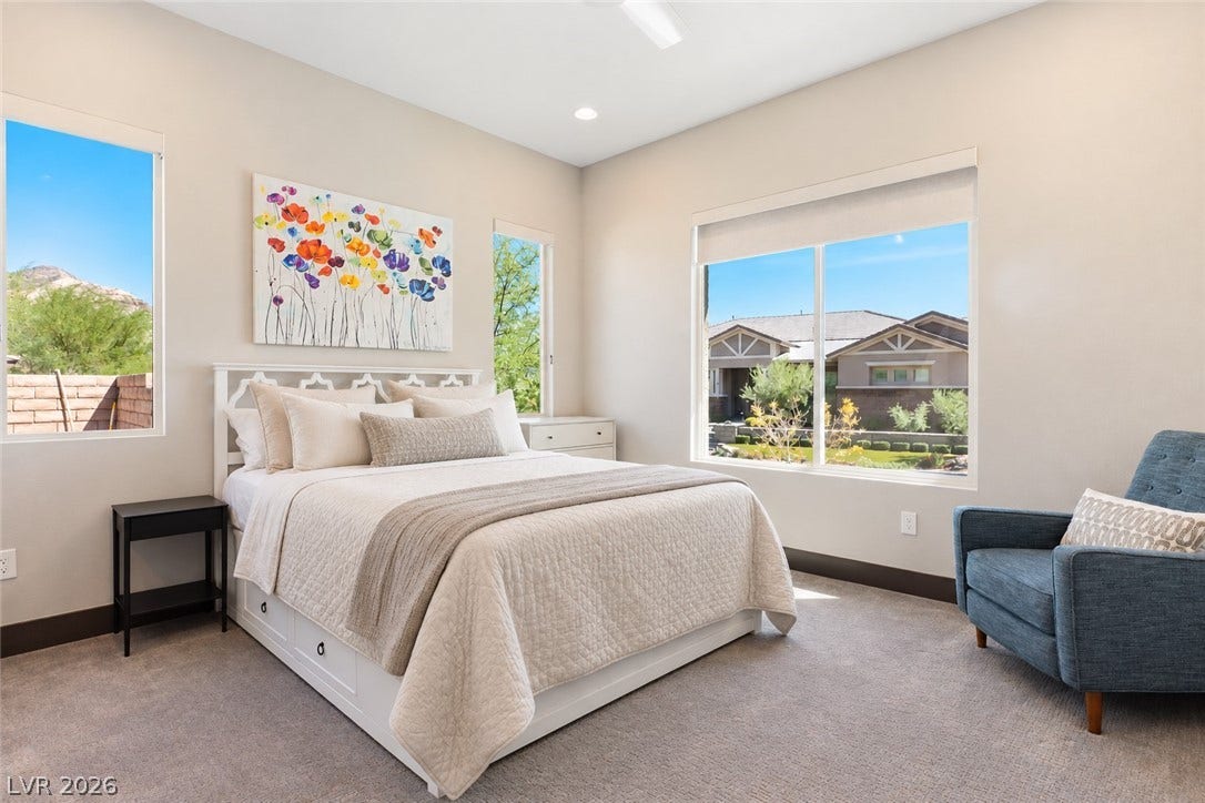 2999 The Peaks Lane, Las Vegas, NV 89138 Spacious downstairs bedroom (2) with en-suite bathroom and custom walk-in closet great winnows allowing natural light.