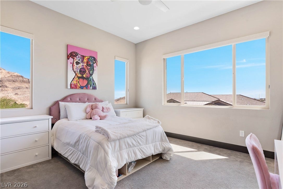2999 The Peaks Lane, Las Vegas, NV 89138 Spacious upstairs bedroom (3) with en-suite bathroom and custom closet and private balcony. Upstairs bedroom 1