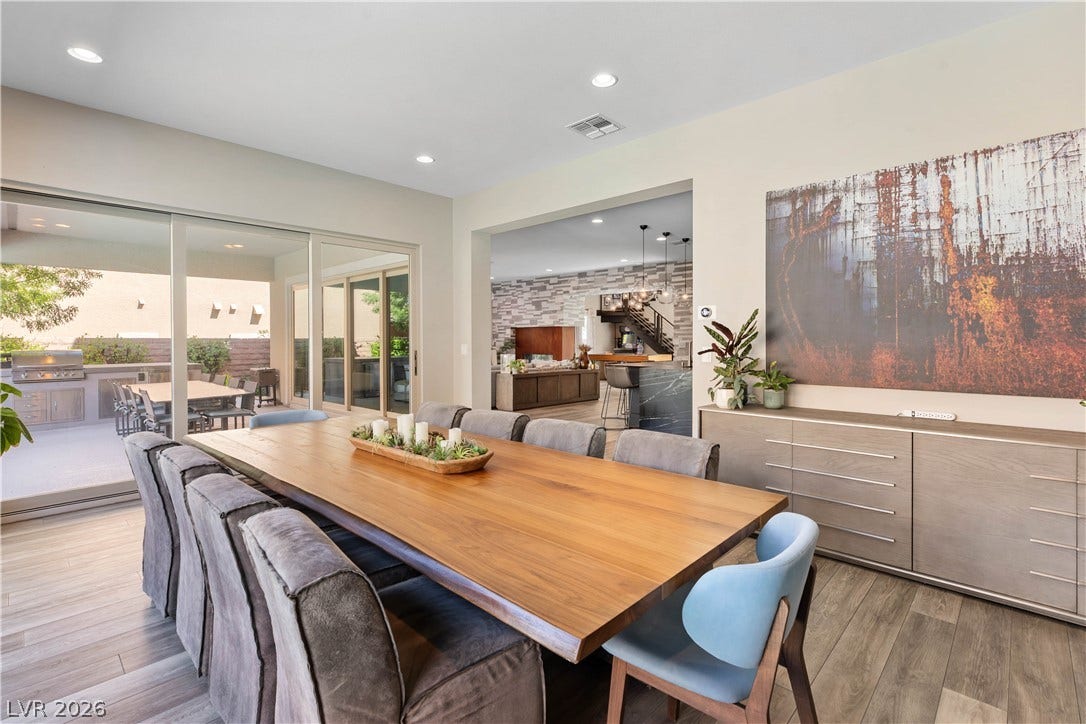 2999 The Peaks Lane, Las Vegas, NV 89138 Beautiful and spacious formal dining area off the kitchen with big glass sliders that allow tons of natural light and connect the dining room to the covered patio and outdoor kitchen.