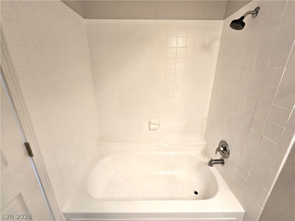 4300 N Lamont Street, #291, Las Vegas, NV 89115 A classic bathtub is framed by clean tiled walls.