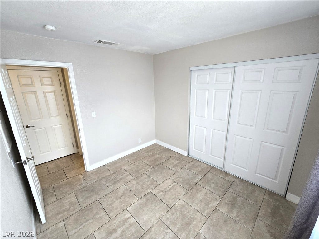 4300 N Lamont Street, #291, Las Vegas, NV 89115 Tiled flooring and large sliding closet doors highlight this comfortable space.