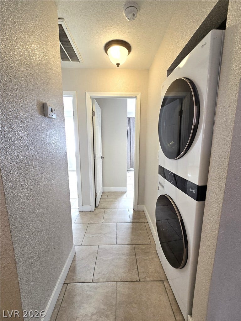 4300 N Lamont Street, #291, Las Vegas, NV 89115 Tiled flooring runs throughout this functional hallway space equipped with laundry hookups.