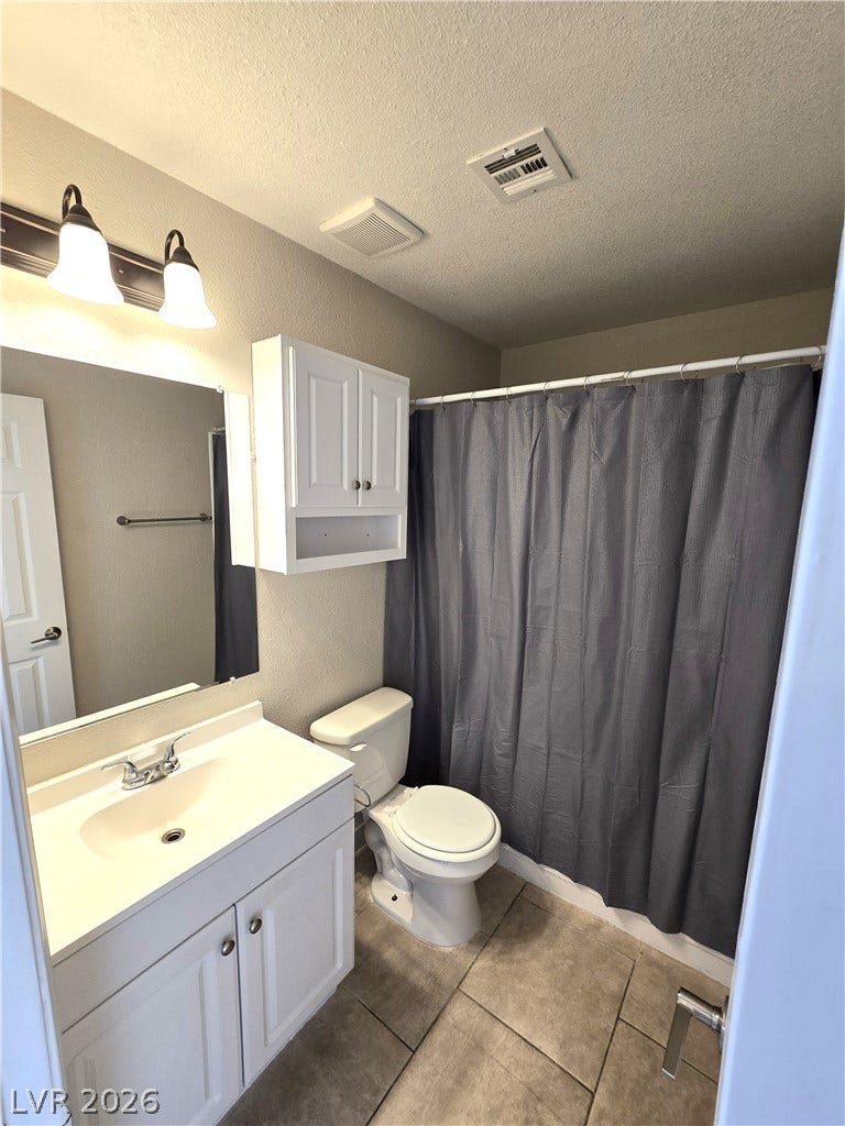 4300 N Lamont Street, #291, Las Vegas, NV 89115 A classic vanity and tile flooring define this functional bathroom space.