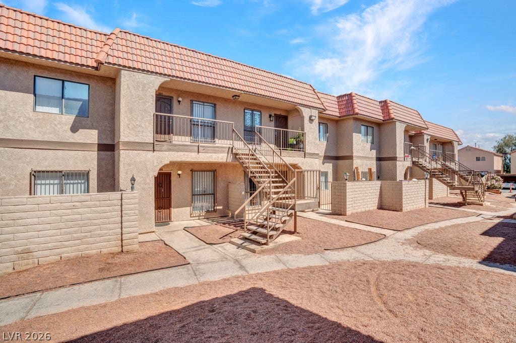 4300 N Lamont Street, #291, Las Vegas, NV 89115 Stucco exteriors and tile roofing define this multi-level residential complex.