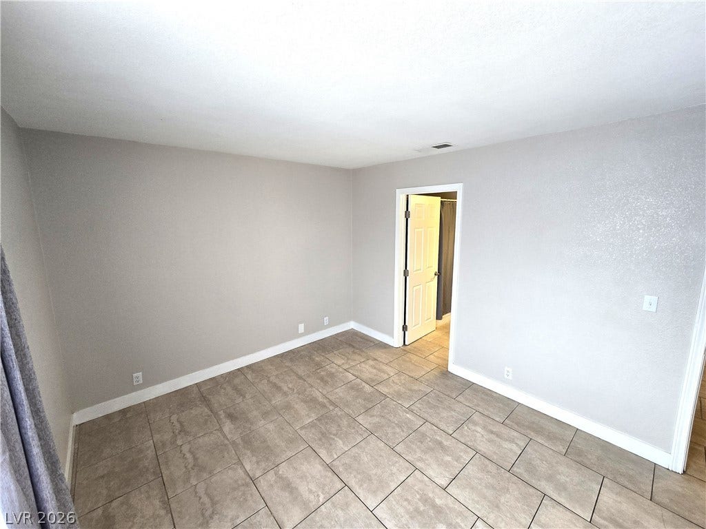 4300 N Lamont Street, #291, Las Vegas, NV 89115 Durable tile flooring runs throughout this versatile room with an attached private bathroom.