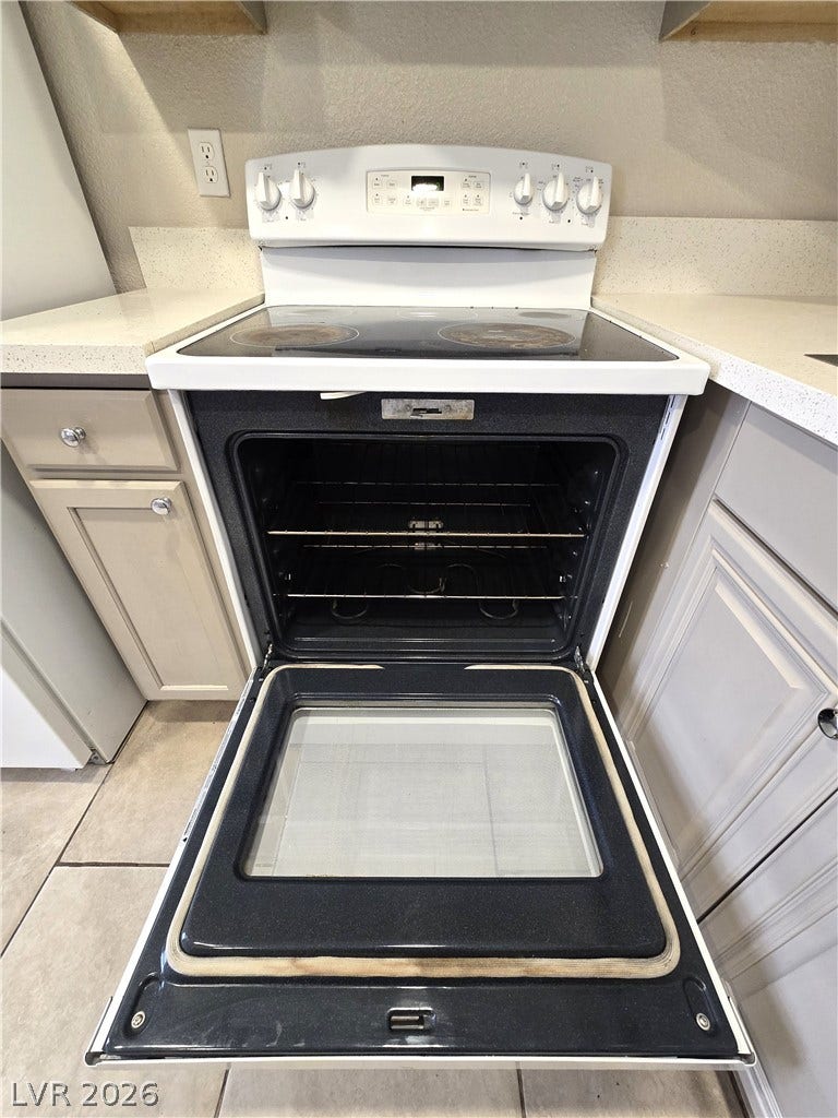 4300 N Lamont Street, #291, Las Vegas, NV 89115 Smooth countertops flank a classic range with an integrated oven and cooktop surface.