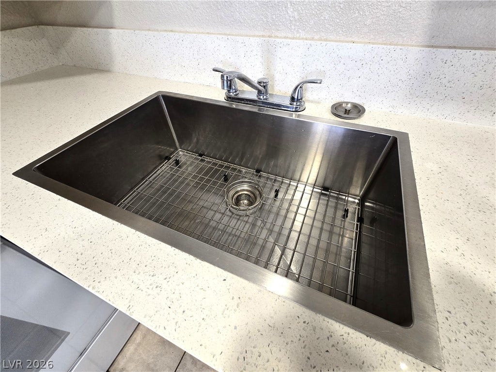 4300 N Lamont Street, #291, Las Vegas, NV 89115 A deep stainless steel basin sink integrates seamlessly into polished stone counters.
