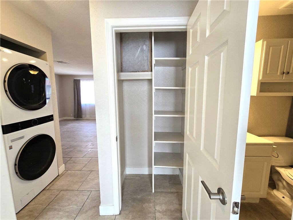 4300 N Lamont Street, #291, Las Vegas, NV 89115 Smartly arranged storage shelving stands adjacent to the utility area and secondary bathroom.