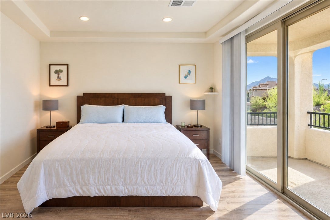 11886 Corenzio Avenue, Las Vegas, NV 89138 Sliding glass doors open from this Master bedroom to a private covered balcony.