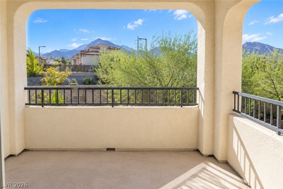 11886 Corenzio Avenue, Las Vegas, NV 89138 A private covered balcony frames scenic views of the surrounding mountains and desert landscape.
