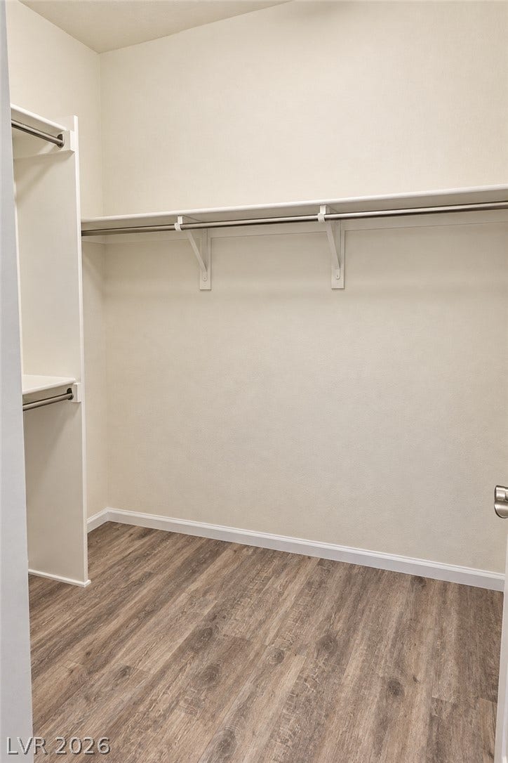 11886 Corenzio Avenue, Las Vegas, NV 89138 Generous closet space featuring durable wood-look flooring and custom built-in shelving.