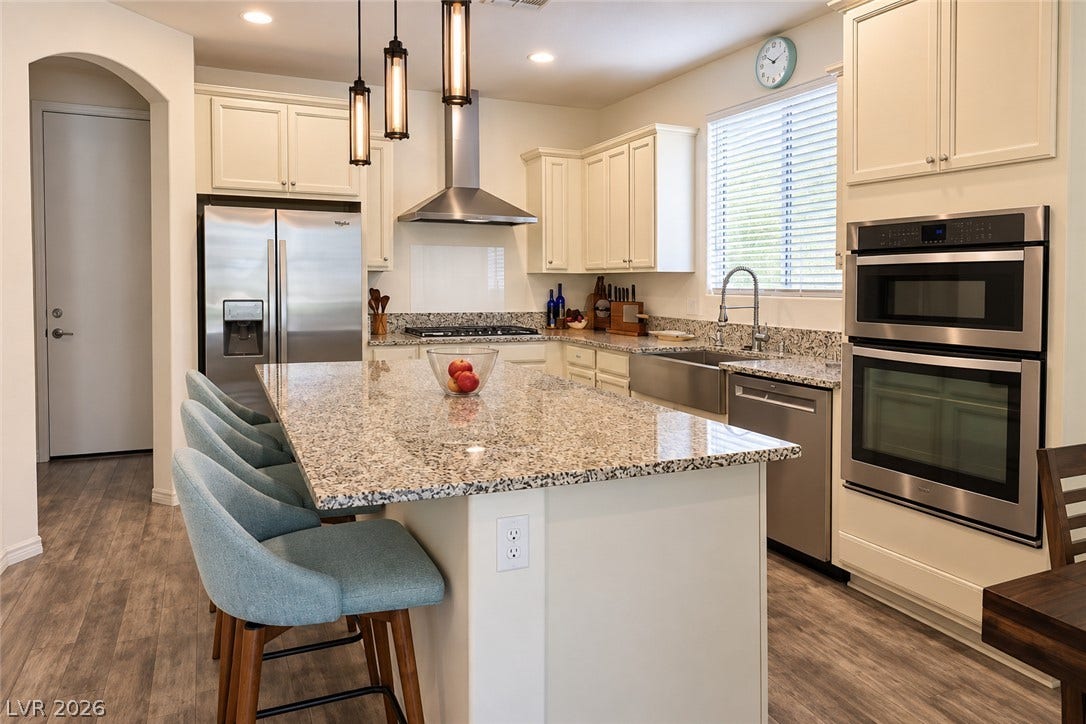 11886 Corenzio Avenue, Las Vegas, NV 89138 Polished granite countertops and classic cabinetry anchor this well-equipped kitchen layout.