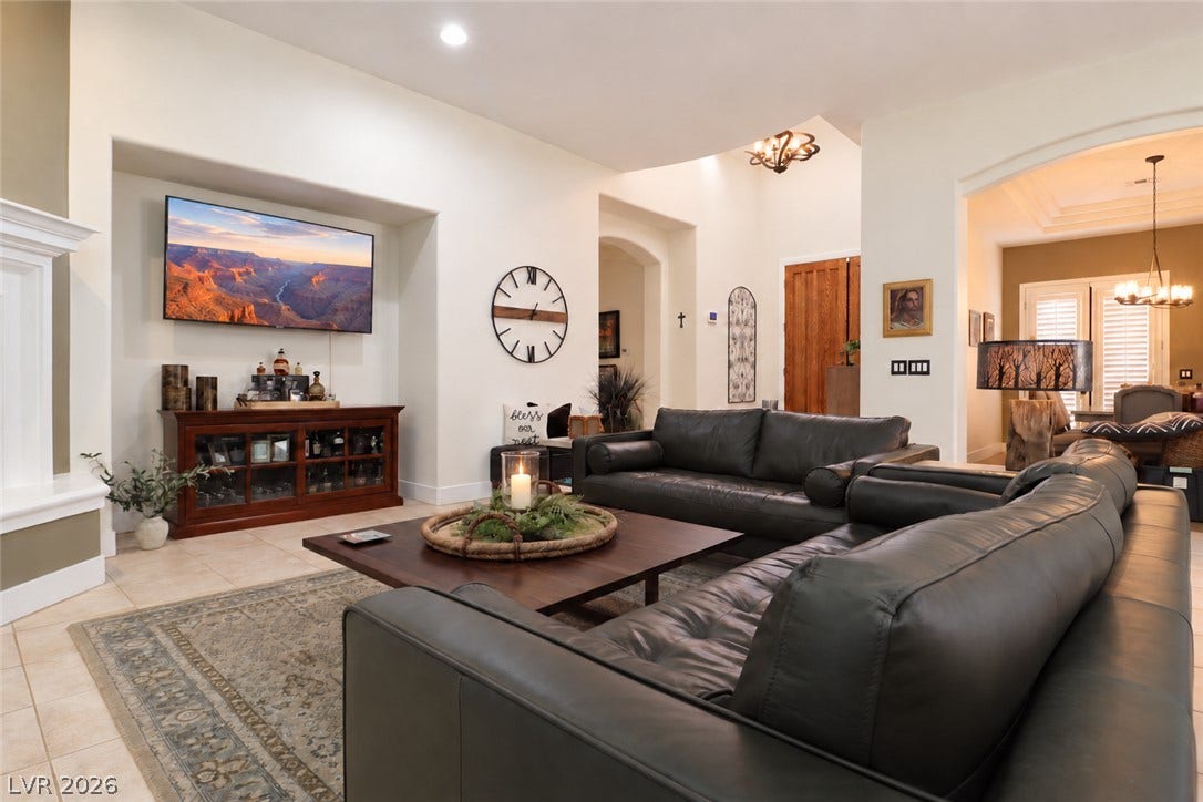 10 Caminito Amore, Henderson, NV 89011 Gleaming tile floors and soaring ceilings define this airy, open-concept living area.