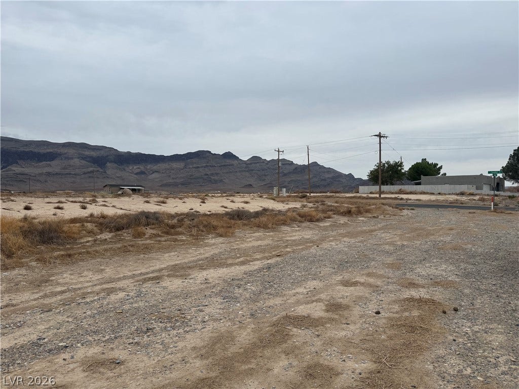 5560 N Linda Street, Pahrump, NV 89060 Dramatic mountain peaks rise in the distance beyond this expansive desert landscape.
