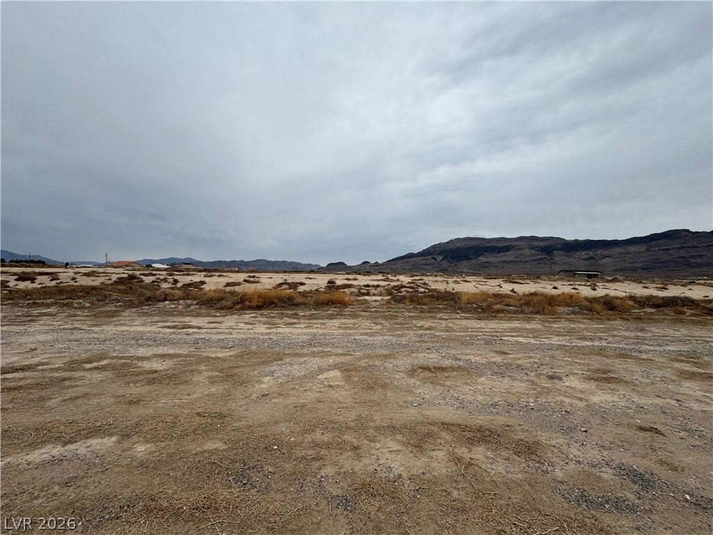 5560 N Linda Street, Pahrump, NV 89060 Expansive desert vistas stretch toward rugged mountain ridges under an open sky.