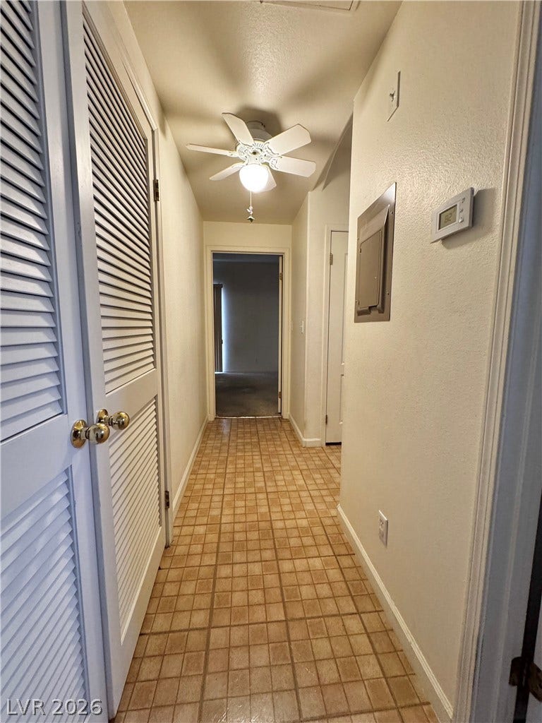 1900 N Torrey Pines Drive, #101, Las Vegas, NV 89108 Tiled flooring runs throughout this functional hallway connecting the home's living areas.