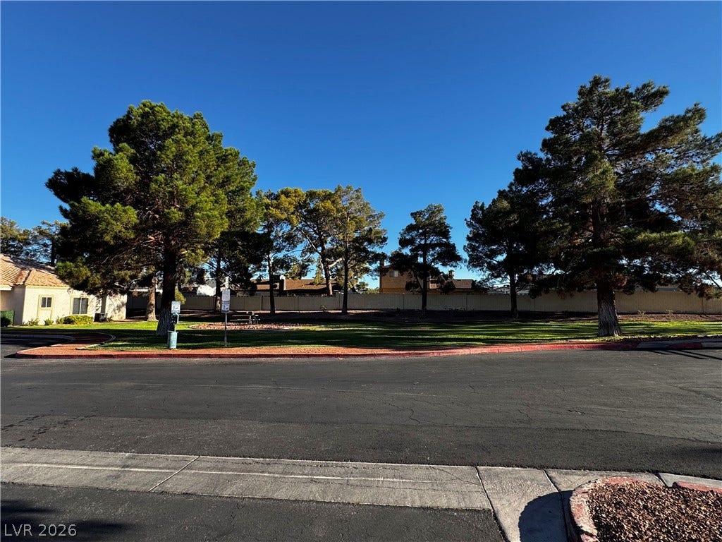 1900 N Torrey Pines Drive, #101, Las Vegas, NV 89108 Mature trees frame a neighborhood park bordered by quiet suburban streets.