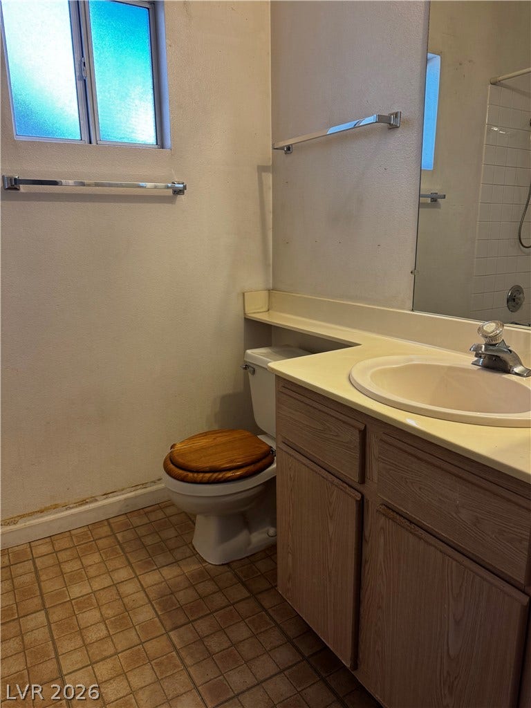 1900 N Torrey Pines Drive, #101, Las Vegas, NV 89108 Functional layout highlights this bathroom featuring a single vanity and tiled flooring.